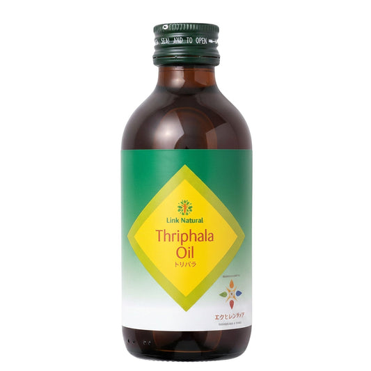 アーユルヴェーダの薬局のLinkナチュラル トリパラオイル180mL。緑と黄色のラベルが特徴的な茶色の遮光ボトル入りアーユルヴェーダオイル